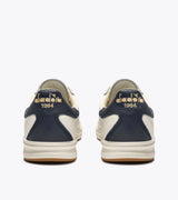 B. ELITE Dominio | White/Peacoat | DIADORA