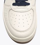 B. ELITE Dominio | White/Peacoat | DIADORA